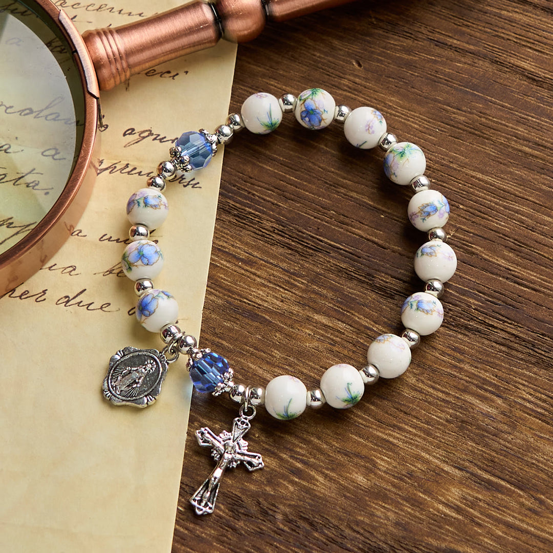 Christianartworkshop Multi-color Floral Ceramic Stretch Bracelet with Miraculous Medal & Crucifix: Subtle Faith Elegance - Blue - image 0